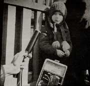 Child being tested for radioactivity with a Geiger counter.