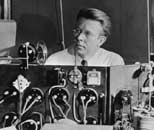 Lawrence at the controls of a 37-inch cyclotron around 1938.